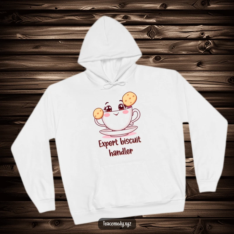 Funny teacup hoodie with wide eyes balancing a biscuit, a cozy and humorous design perfect for relaxing moments.